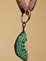 Load and play video in Gallery viewer, Kiwi Slice charm close-ups and 360° spin; clip on/off demonstration
