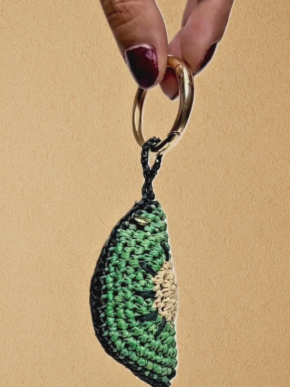 Kiwi Slice charm close-ups and 360° spin; clip on/off demonstration