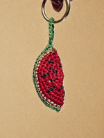 Load and play video in Gallery viewer, Short clip showing the Watermelon Slice charm clipped to a La Vague bag; 360° view and movement
