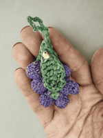 Load image into Gallery viewer, Purple Grapes raffia charm held in hand, clustered crochet
