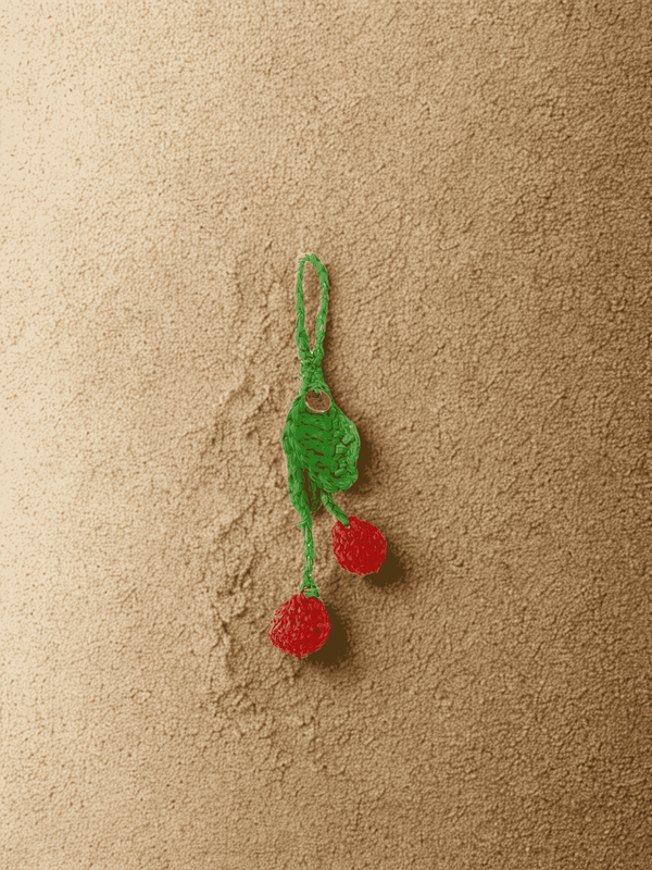 YZA raffia Cherries bag charm with golden tag, handmade in Marrakesh