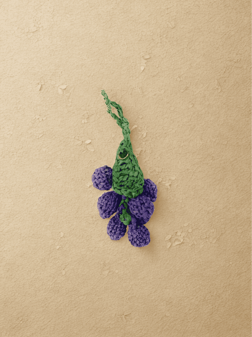 YZA hand-crocheted raffia Purple Grapes bag charm with golden tag, handmade in Marrakesh