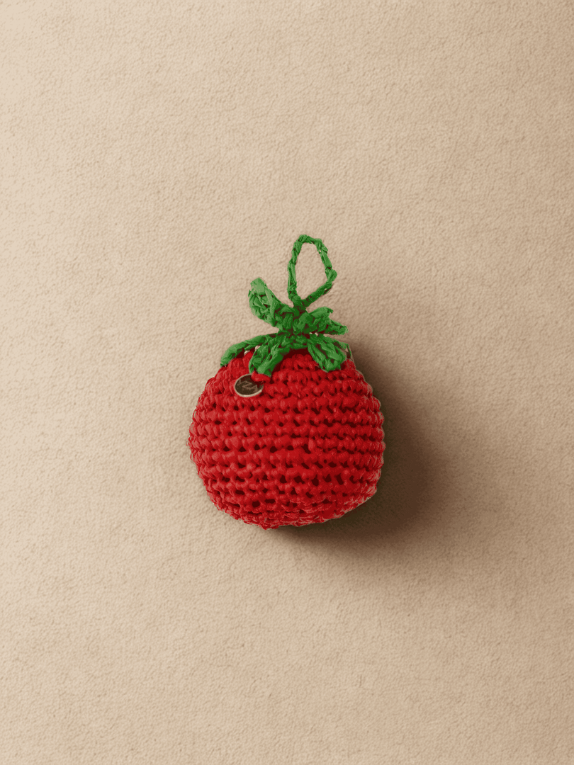 YZA hand-crocheted raffia Tomato bag charm with golden tag, handmade in Marrakesh