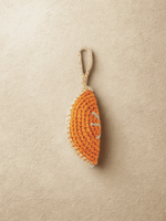 Load image into Gallery viewer, YZA raffia Orange Slice bag charm with golden tag, handmade in Marrakesh
