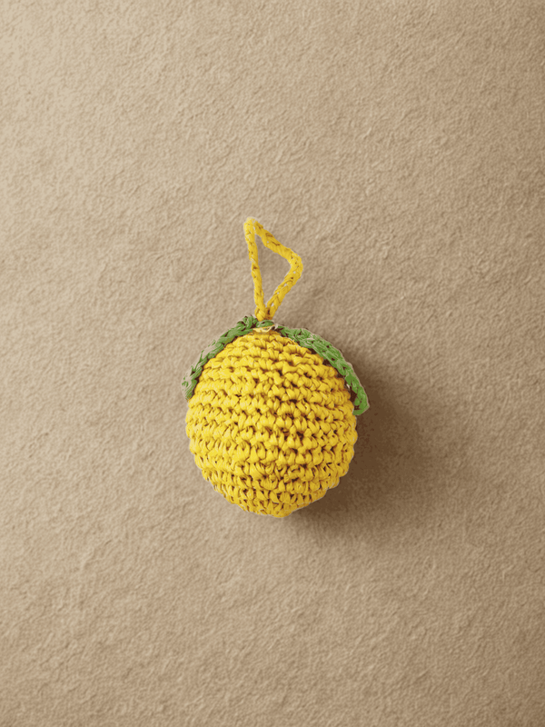 YZA raffia Lemon bag charm with golden YZA tag, handmade in Marrakesh